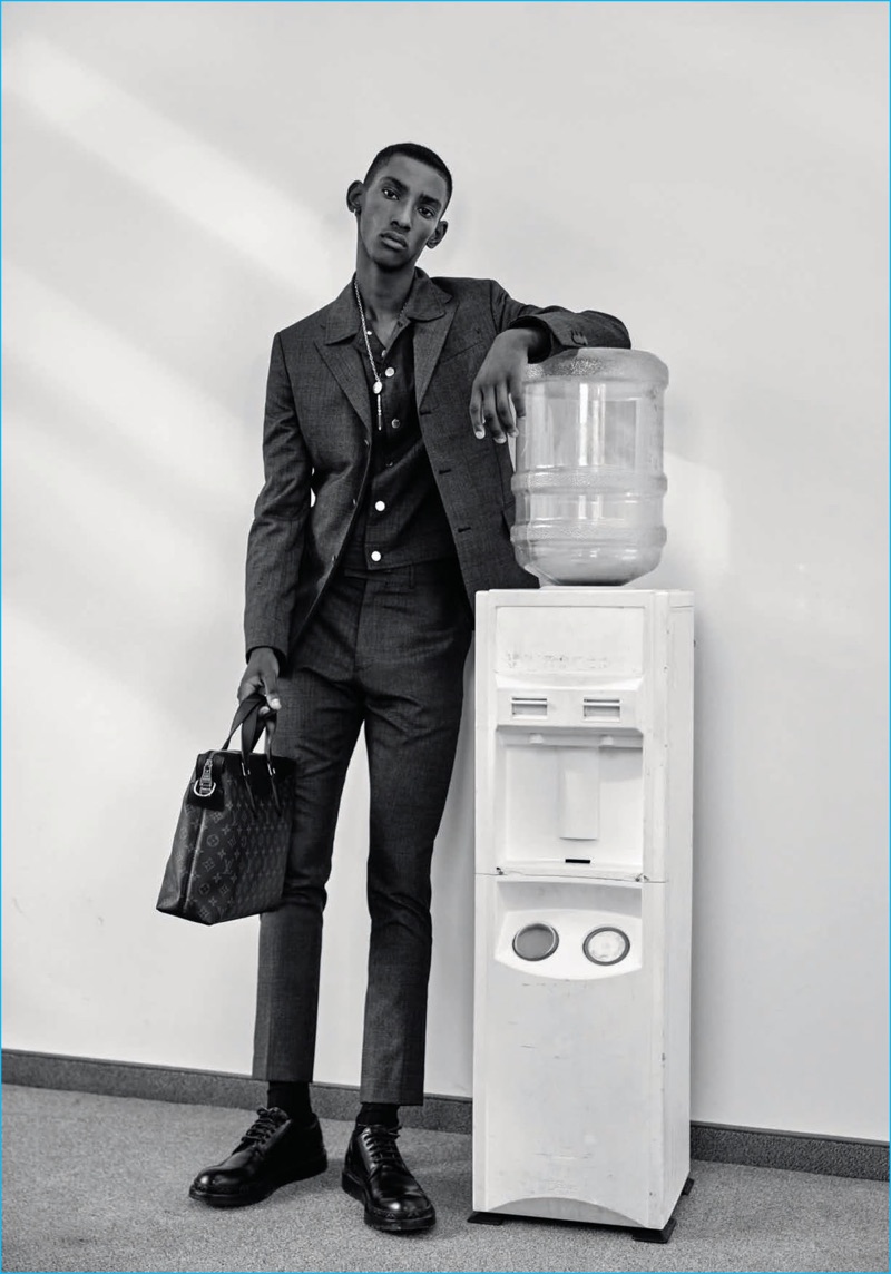 Donning trim suiting, Myles Dominique wears Louis Vuitton for the pages of L'Officiel Hommes Germany.