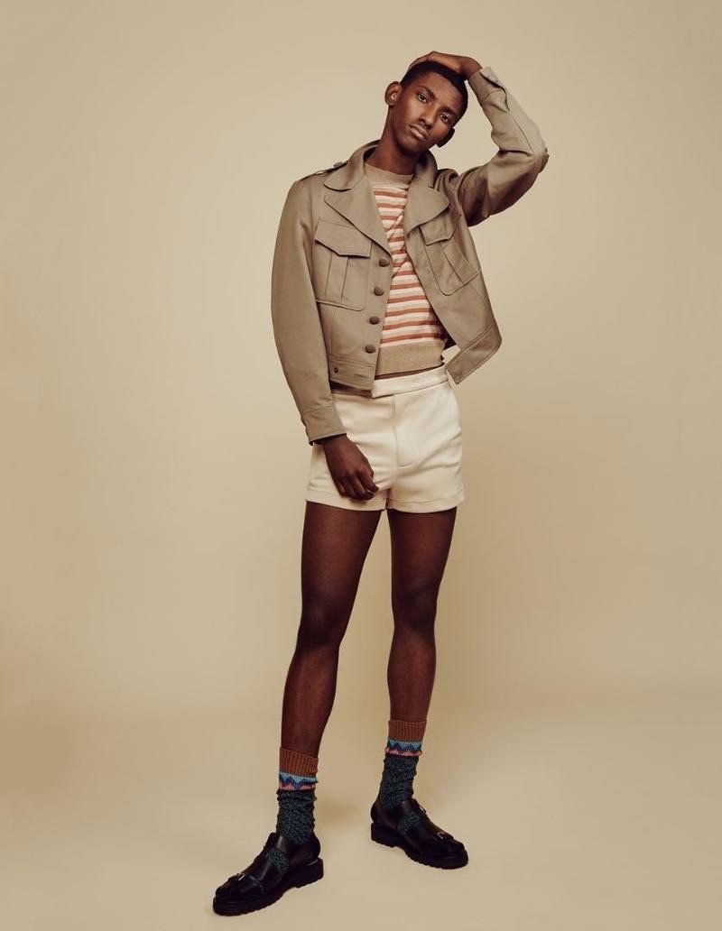 Getting a leg up on the season, Myles Dominique dons Topman Design shorts and a sweater with an Agi & Sam wool jacket.