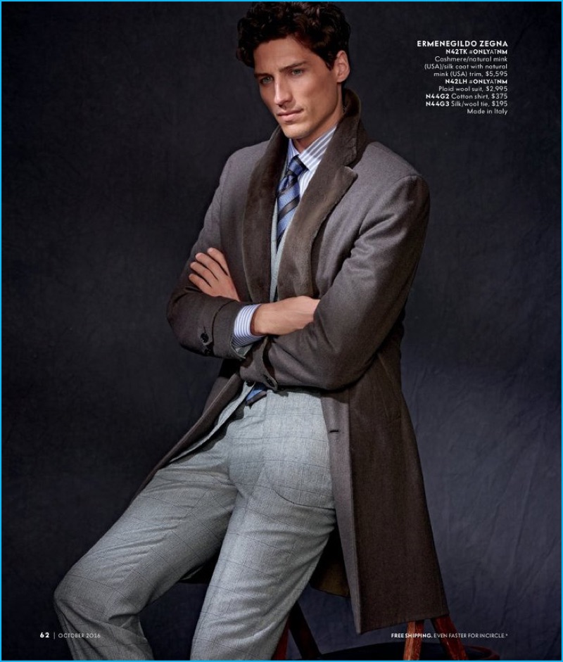 Ryan Kennedy dons a cashmere, mink, and silk coat with a wool suit by Ermenegildo Zegna.