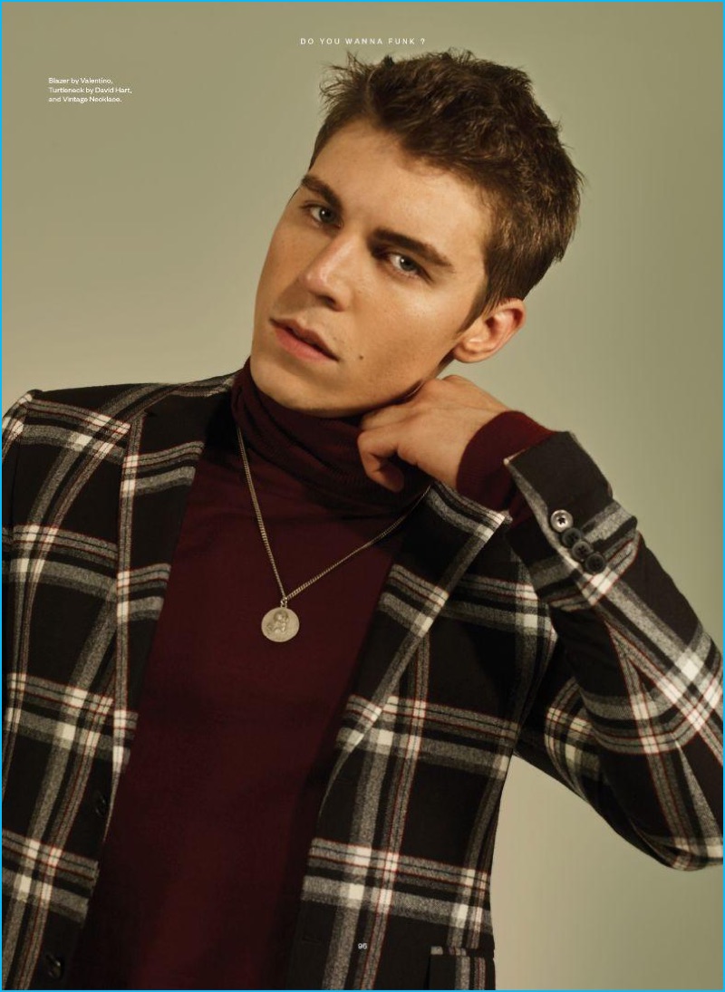 Nolan Gerard Funk wears a plaid blazer by Valentino with a David Hart turtleneck and vintage medallion necklace.