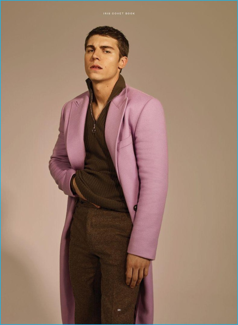 Actor Nolan Gerard Funk dons a Versace coat with a Lacoste sweater and David Hart trousers.
