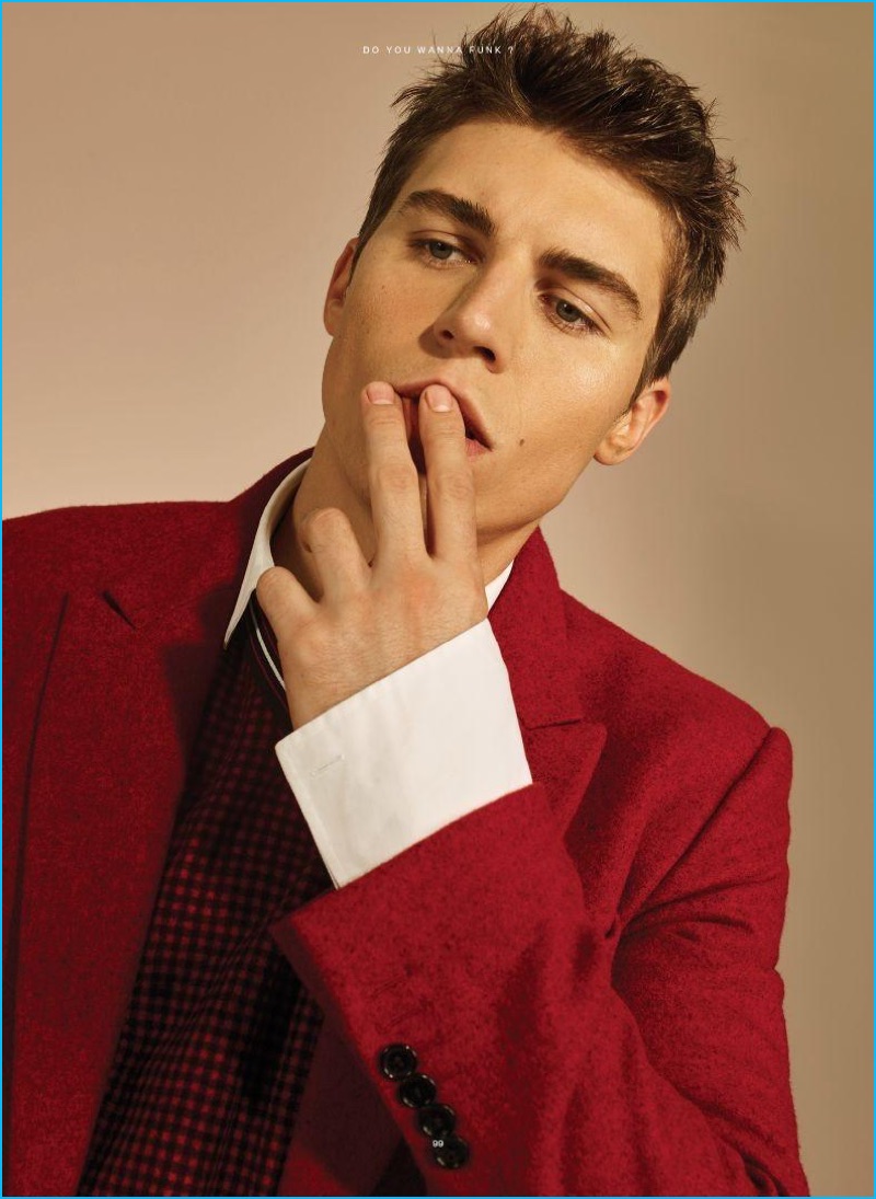 Bon Duke photographs Nolan Gerard Funk in a red, black, and white look from Dior Homme.