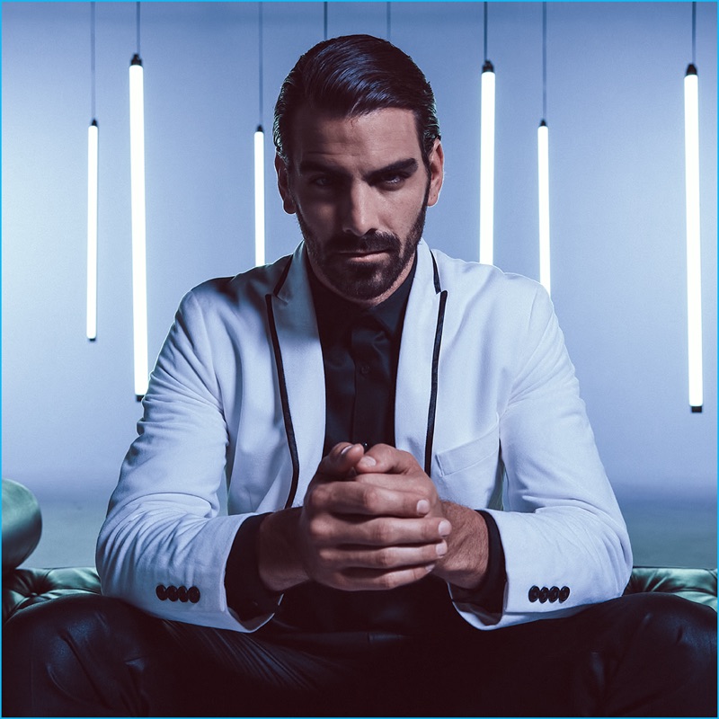 Dressed to impress, Nyle DiMarco wears a white blazer with black piping from INC International Concepts.