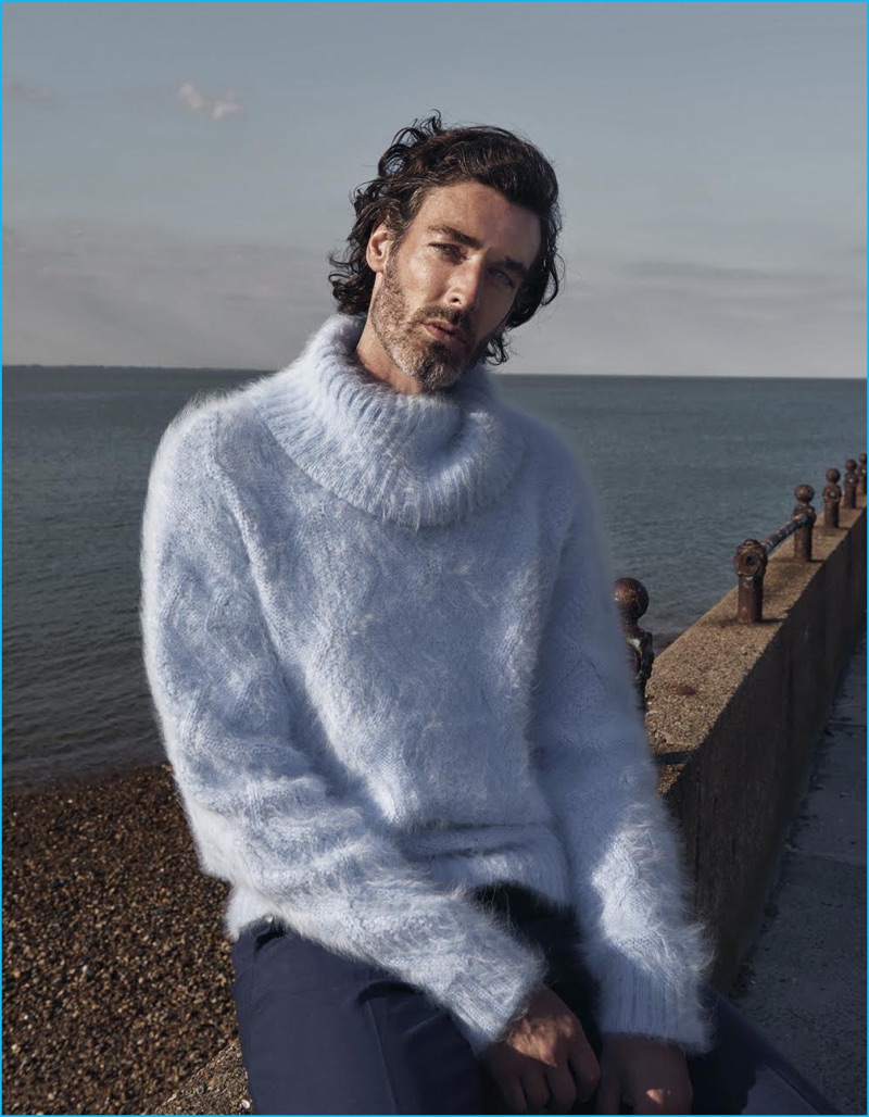 Onin Lorente photographs Richard Biedul in a light blue mohair sweater from Versace with Gucci trousers.