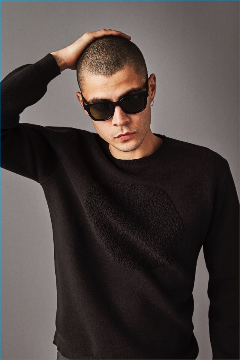 Model Micky Ayoub wears an uneven circle sweatshirt from Saturdays NYC.