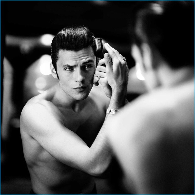 Silviu Tolu primps and preens in front of the mirror, perfecting his pompadour. 