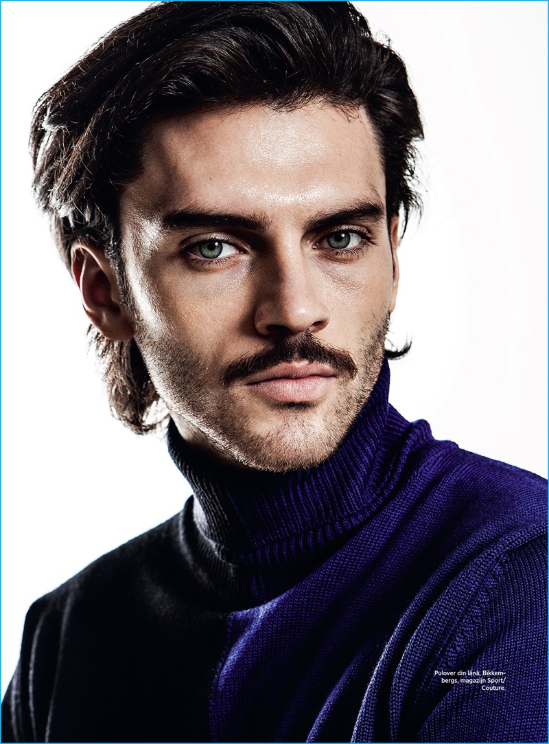 Ready for his close-up, Silviu Tolu sports a Bikkembergs turtleneck sweater.