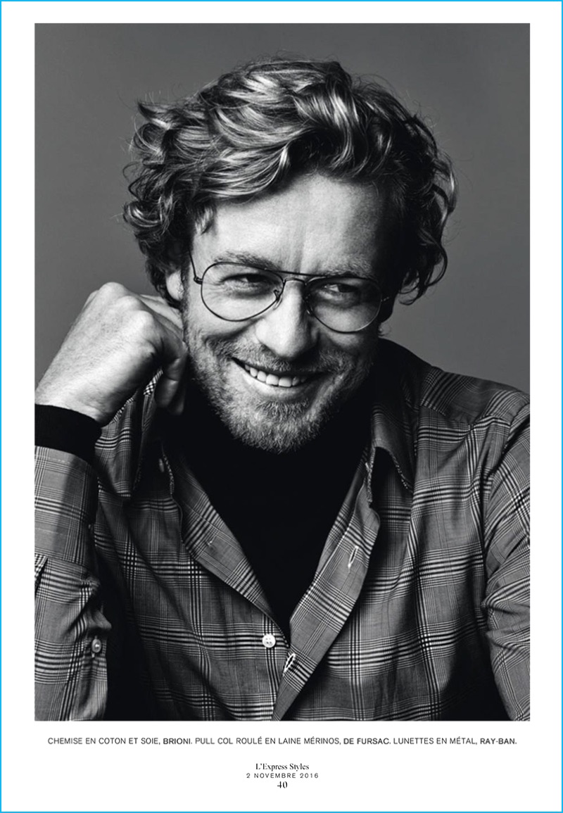 Wearing Ray-Ban glasses and a smile, Simon Baker sports a check shirt from Brioni with a De Fursac turtleneck.