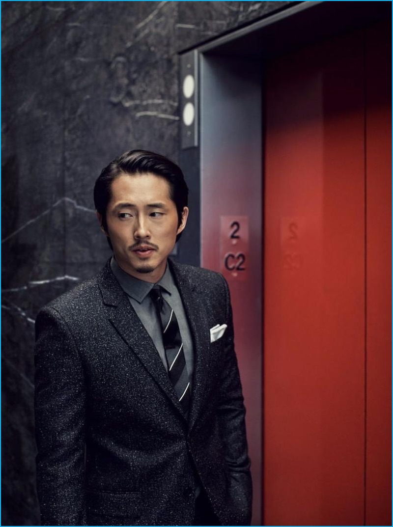 Nathaniel Goldberg photographs Steven Yeun in a Givenchy suit with a Burberry shirt, Dolce & Gabbana tie, and Paul Stuart pocket square.