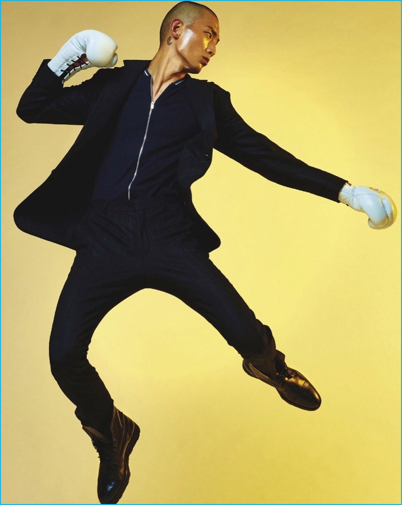 Korean model Sung Jin Park plays a boxer in a wool suit, cashmere-silk jacket, and leather boots by Hermès.