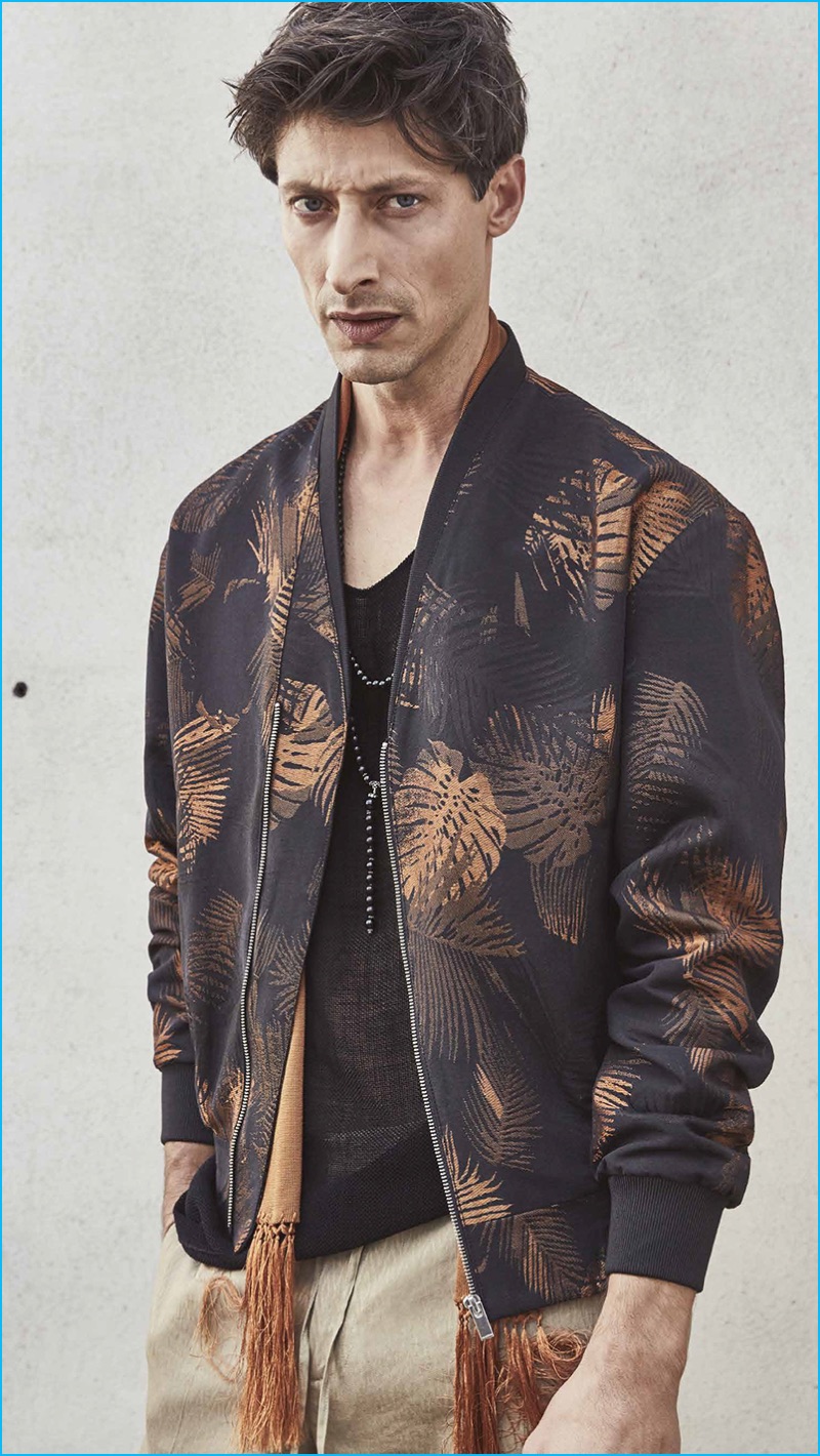 Model Jason Mason dons a patterned bomber jacket from The Kooples' spring-summer 2017 men's collection.