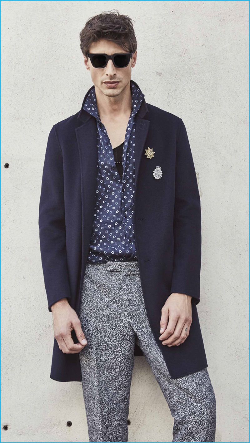A cool vision, Jonas Mason sports a navy coat with a patterned shirt and trousers by The Kooples. » Travel the World with The Kooples' Spring 2017 Collection A cool vision, Jonas Mason sports a navy coat with a patterned shirt and trousers by The Kooples.