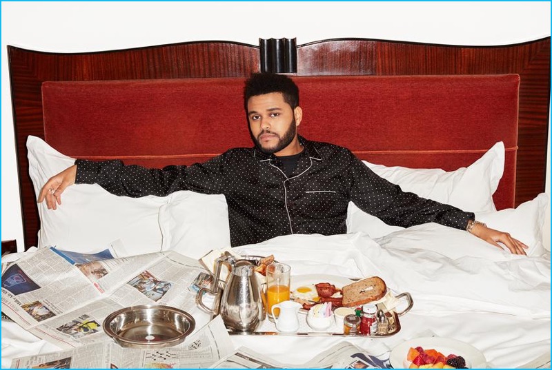 Relaxing in bed, The Weeknd sports a Dolce & Gabbana pajama shirt with a Calvin Klein t-shirt.