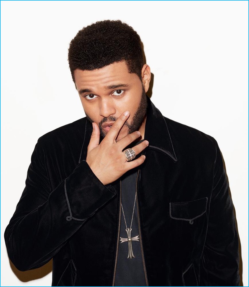 Front and center, The Weeknd dons a Calvin Klein t-shirt with his own jacket and necklace.