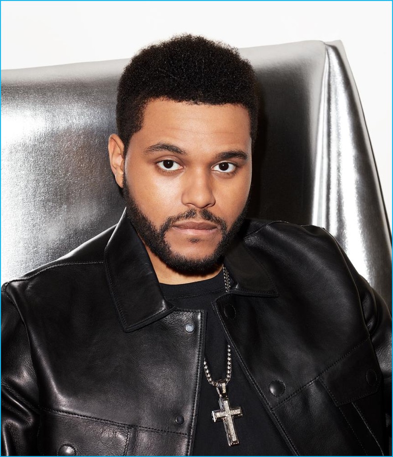 Matthew Henson outfits The Weeknd in a Calvin Klein t-shirt and leather jacket from Emporio Armani.