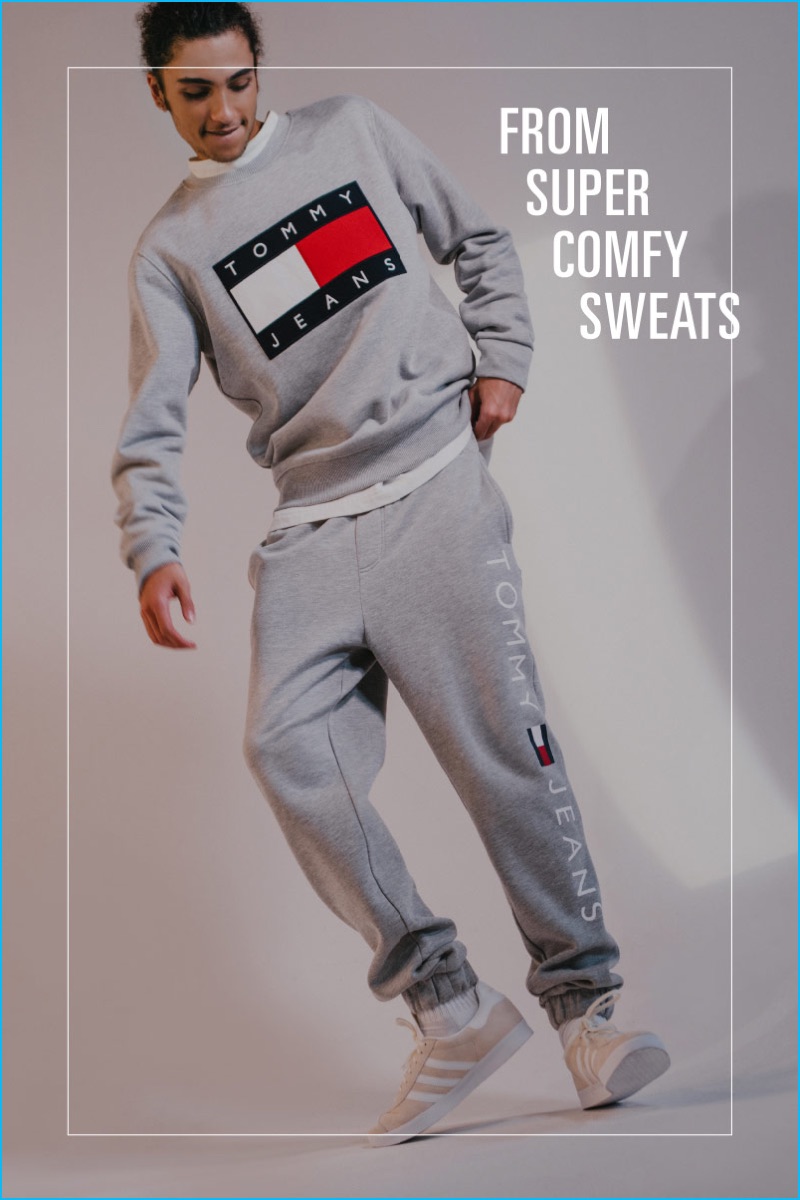 Going sporty, Tre Samuels wears a sweatshirt and sweatpants from Tommy Jeans for Urban Outfitters.