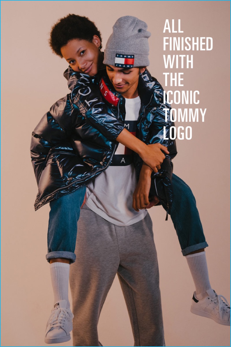 Lineisy Montero embraces Tre Samuels as they sport fashions from Tommy Jeans for Urban Outfitters.
