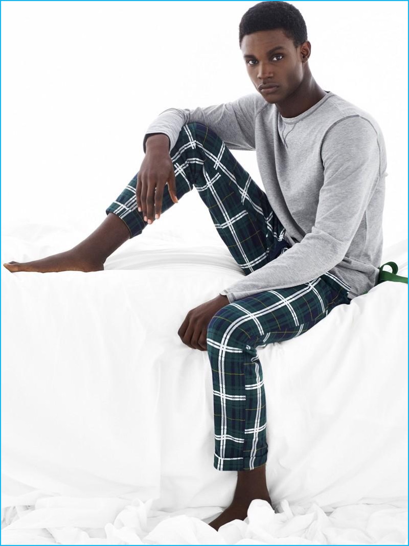 Victor Ndigwe relaxes in comfortable pajamas for Undercolors of Benetton's holiday 2016 campaign.