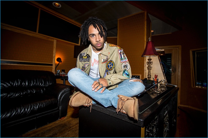 Rapper Vic Mensa poses in the studio, wearing UGG's Butte boots.