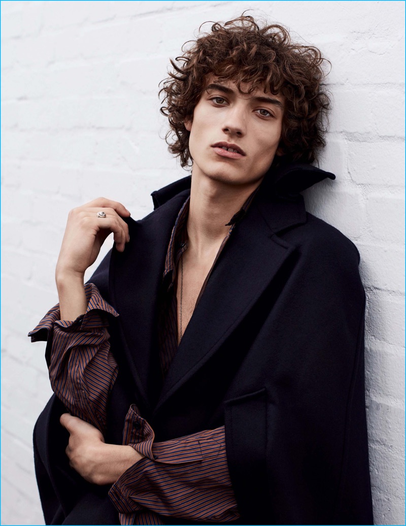 Serge Rigvava models a Prada cape and shirt for Vogue Hommes Paris.