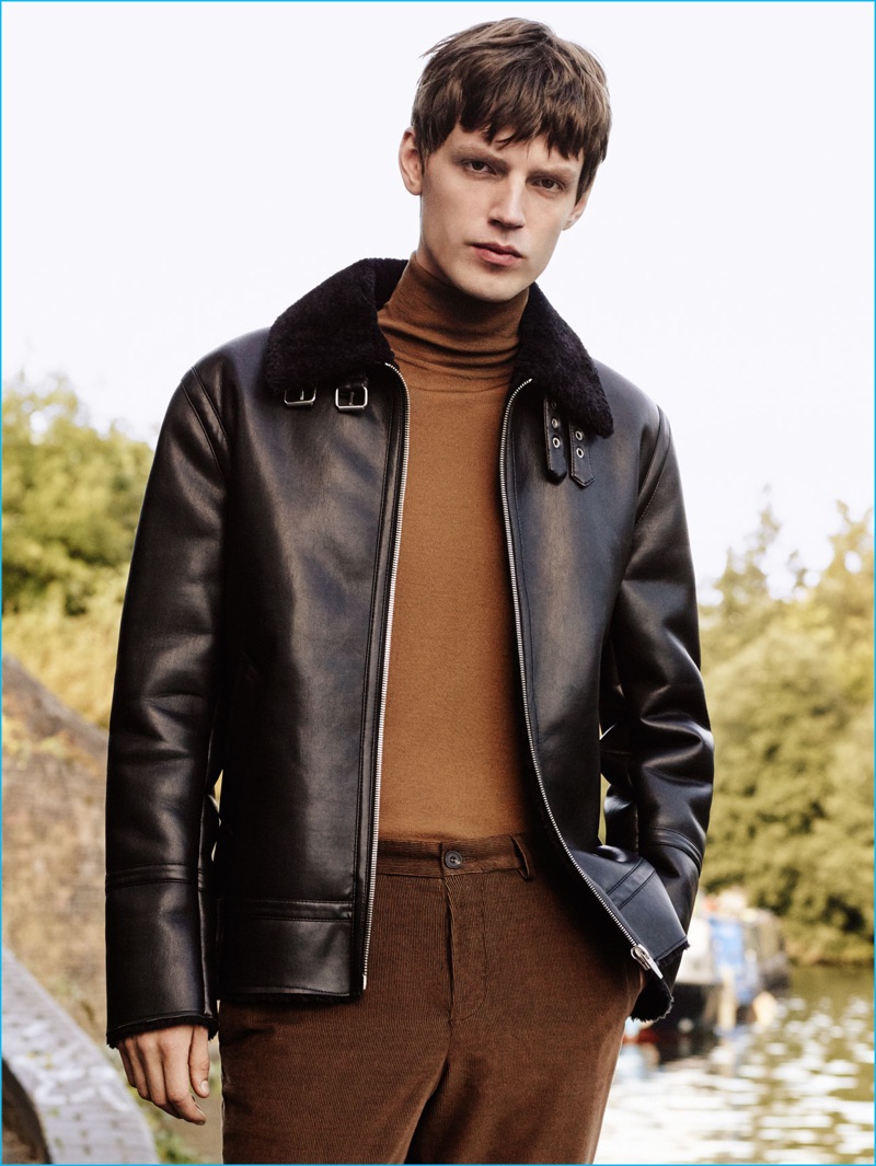 English model Callum Ward sports a faux leather jacket with a turtleneck and corduroy pants from Zara Man.