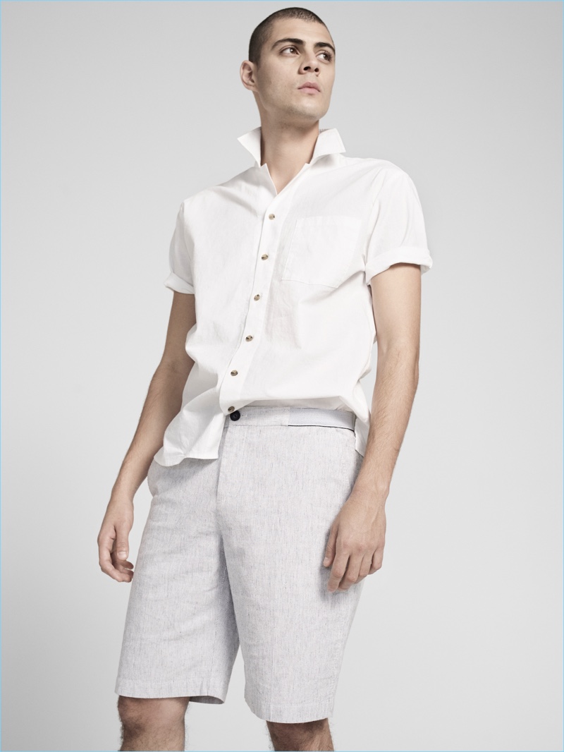 Micky Ayoub turns his collar up as he sports a short-sleeve shirt and tailored shorts from ATM's pre-fall 2016 men's collection.