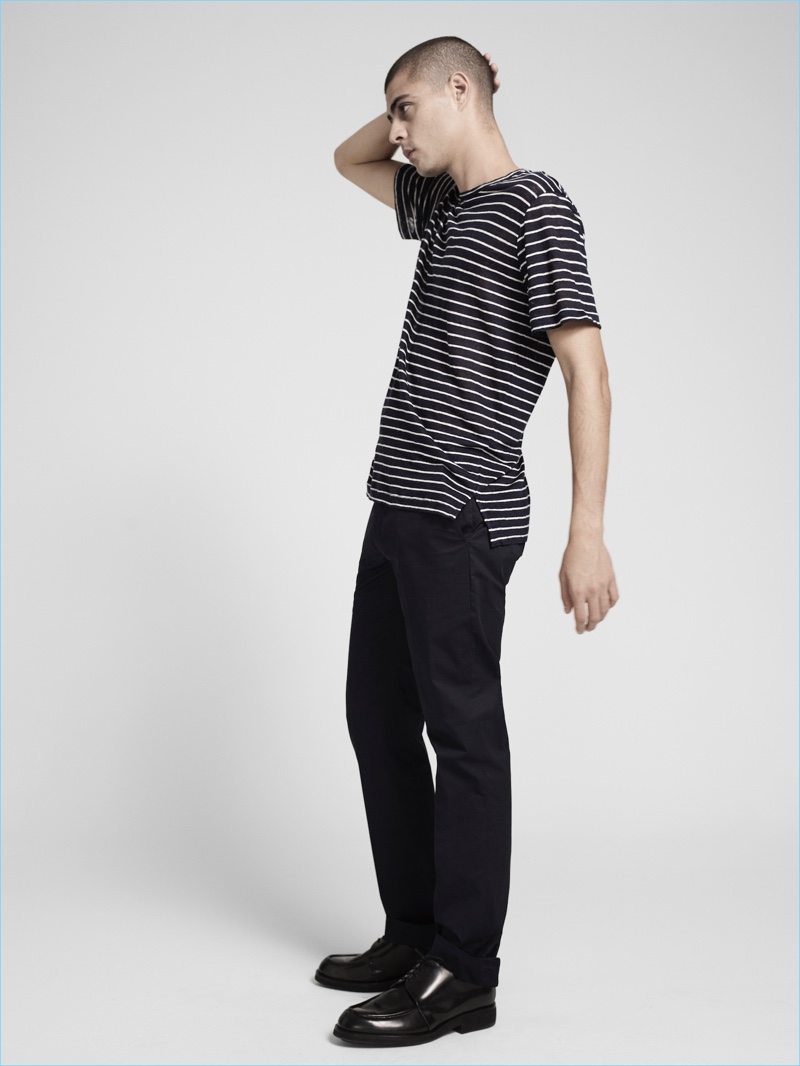 Model Micky Ayoub takes to the studio in a striped tee and black pants from ATM's pre-fall 2017 men's collection.