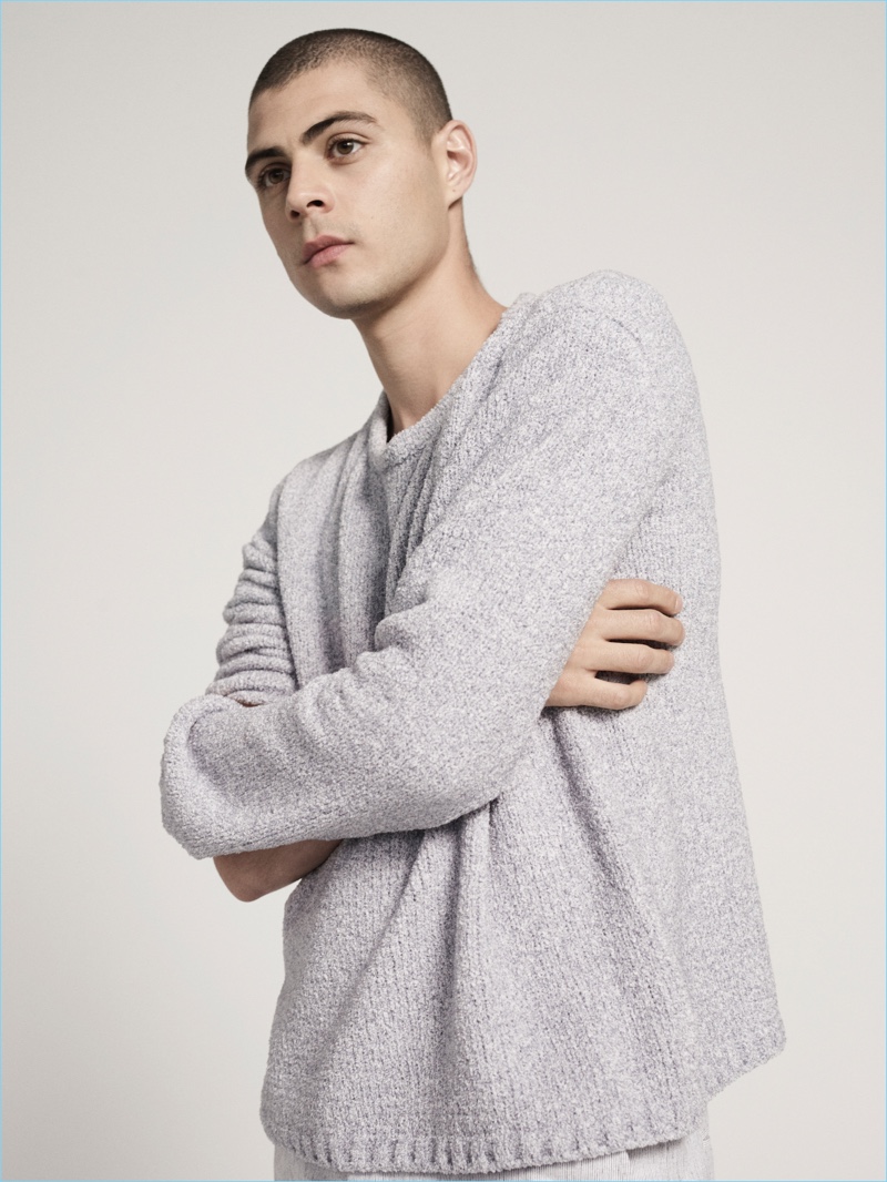 Stealing a quiet moment, Micky Ayoub wears a grey sweater from ATM's pre-fall 2017 collection.