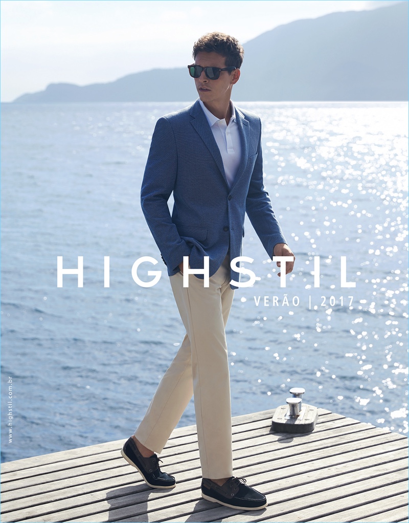 Alexandre Cunha dons a blue sport coat with a white polo and khaki trousers for Highstil's spring-summer 2017 campaign.