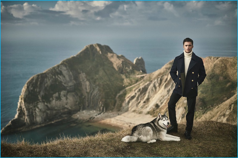 Standing tall, Harvey Haydon rocks a Coach peacoat with a Private White V.C. turtleneck sweater, Incotext trousers, and O'Keeffe boots.