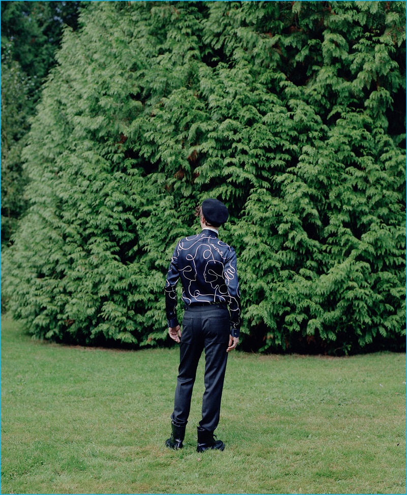 Venturing outdoors, Marc André Turgeon makes a statement in a printed top by Louis Vuitton.
