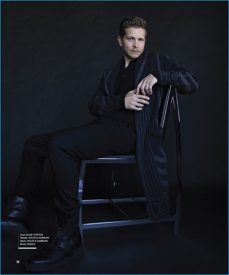 Matt Czuchry dons a Louis Vuitton coat with a henley and pants by Dolce & Gabbana. Czuchry also sports Canali leather boots.