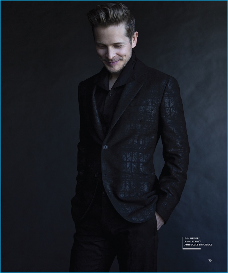 All smiles, Matt Czuchry dons a shirt and patterned blazer by Hermes with Dolce & Gabbana trousers.