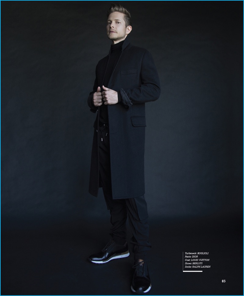 Karl Simone photographs Matt Czuchry in a Boglioli turtleneck, Dior Homme pants, Louis Vuitton coat, and Berluti shoes for Haute Living.