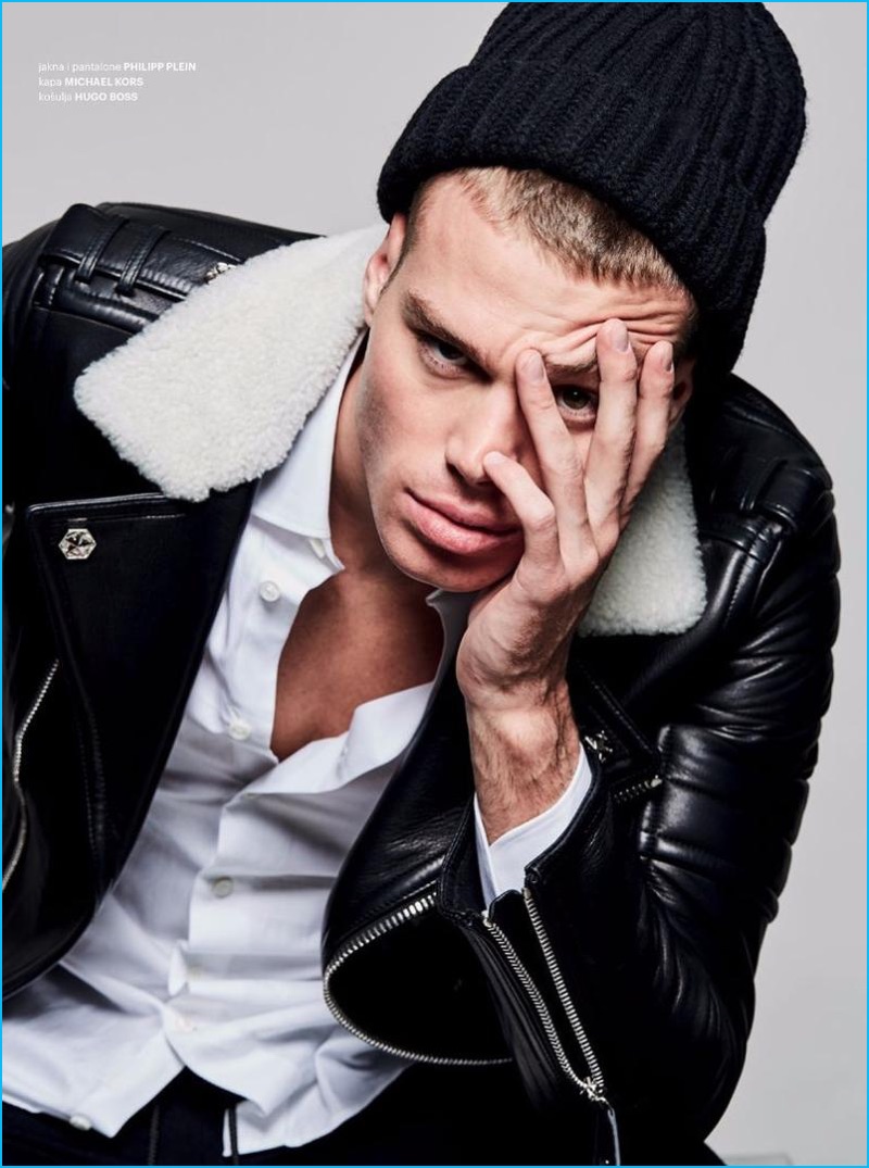 Ivan Genasi photographs Matthew Noszka in a leather jacket and pants by Philipp Plein with a Michael Kors knit beanie and Hugo Boss shirt.