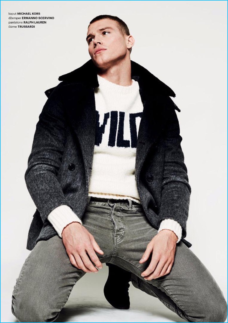 Appearing in an editorial for Esquire Serbia, Matthew Noszka sports a Michael Kors peacoat with an Ermanno Scervino sweater, Ralph Lauren jeans, and Trussardi boots.