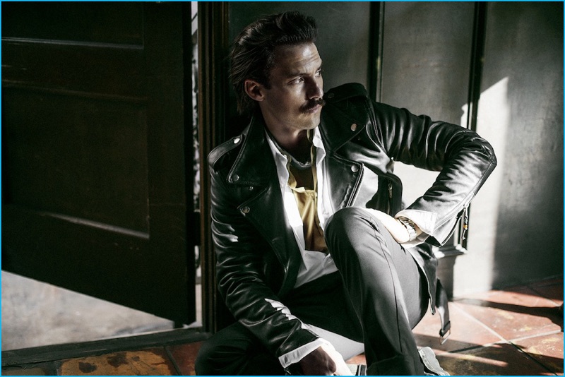 Brian Higbee photographs Milo Ventimiglia in a BLK DNM leather biker jacket, white A.P.C. shirt, Officine Generale shirt, and Acne Studios trousers.