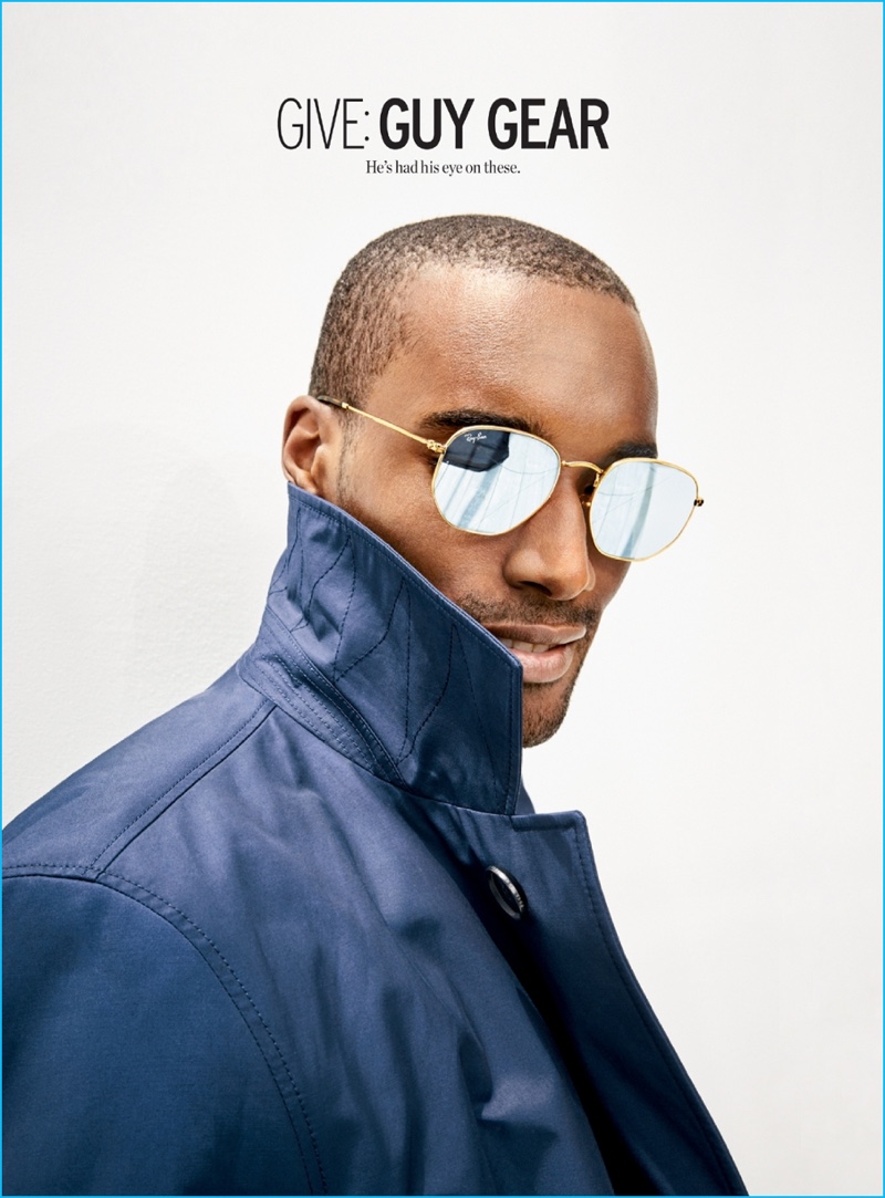 Corey Baptiste is a cool vision in Ray-Ban aviator sunglasses with a BOSS Hugo Boss rain coat.