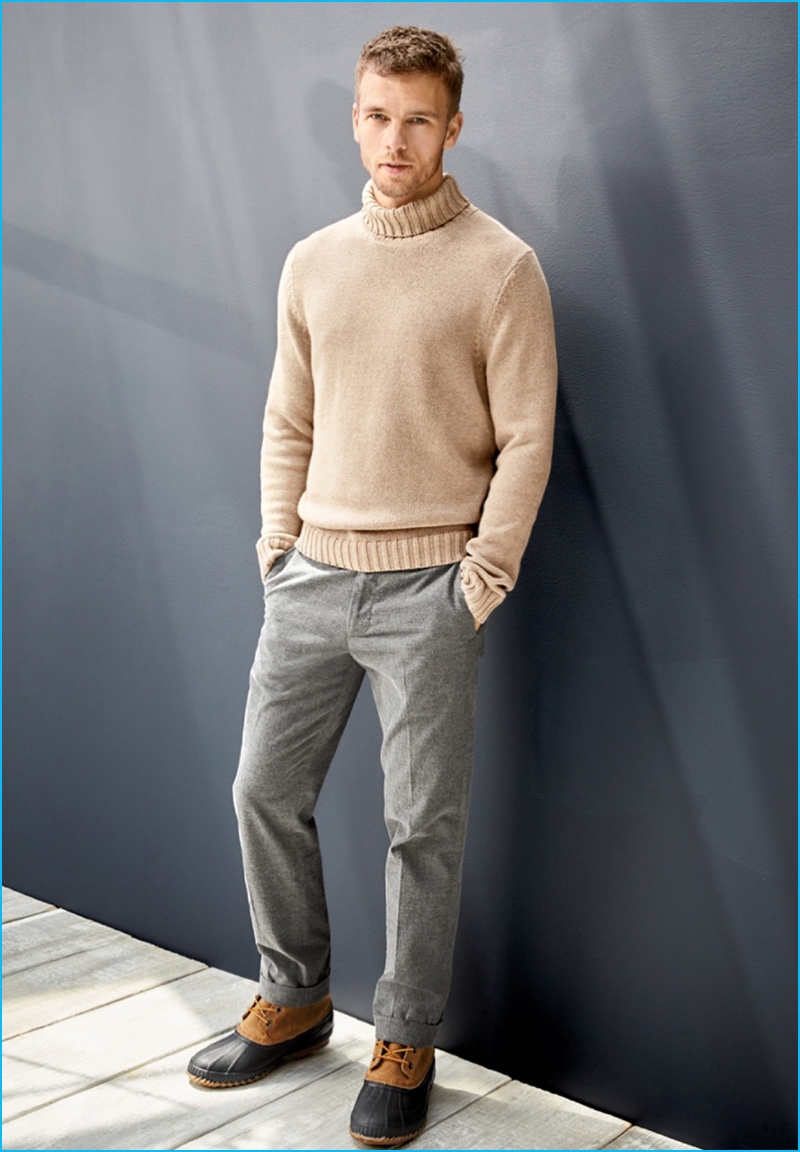 Front and center, Benjamin Eidem wears a Nordstrom Men's Shop chunky cashmere turtleneck sweater with Bonobos trousers, and Sorel snow boots.