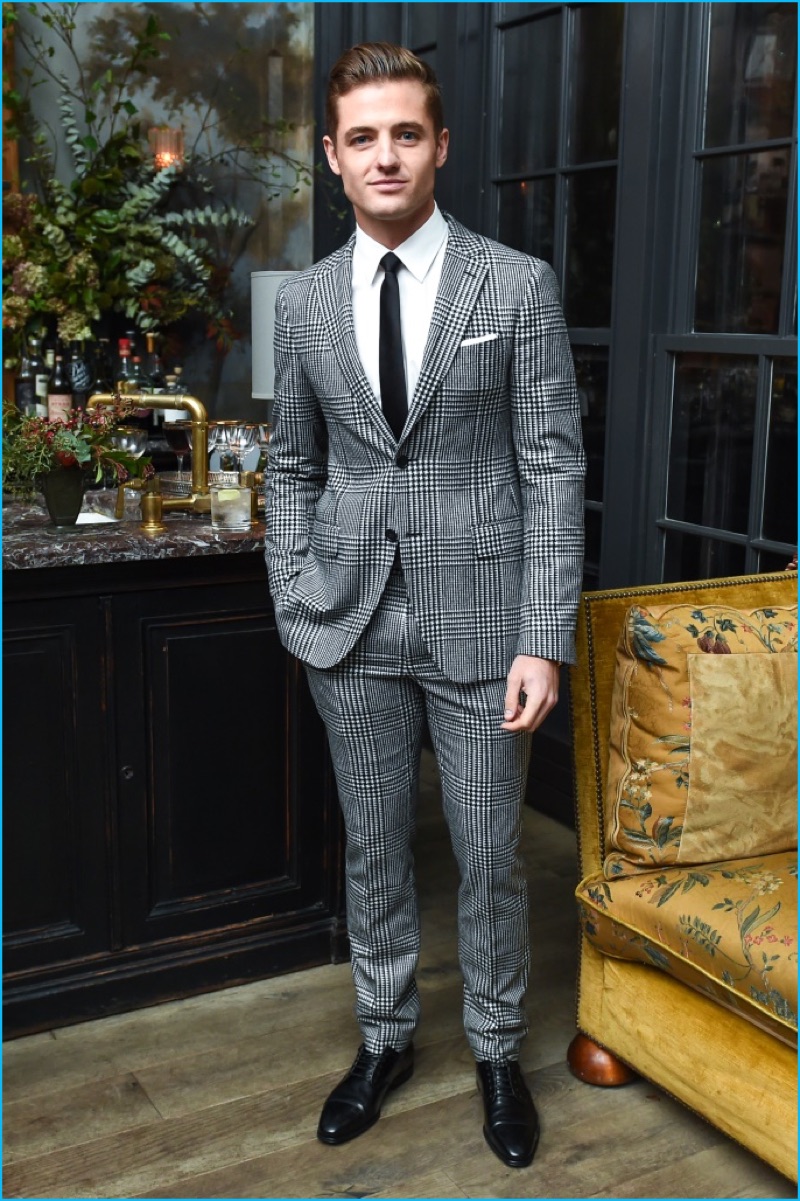 Stepping out in style, Robbie Rogers dons a two-button houndstooth suit.