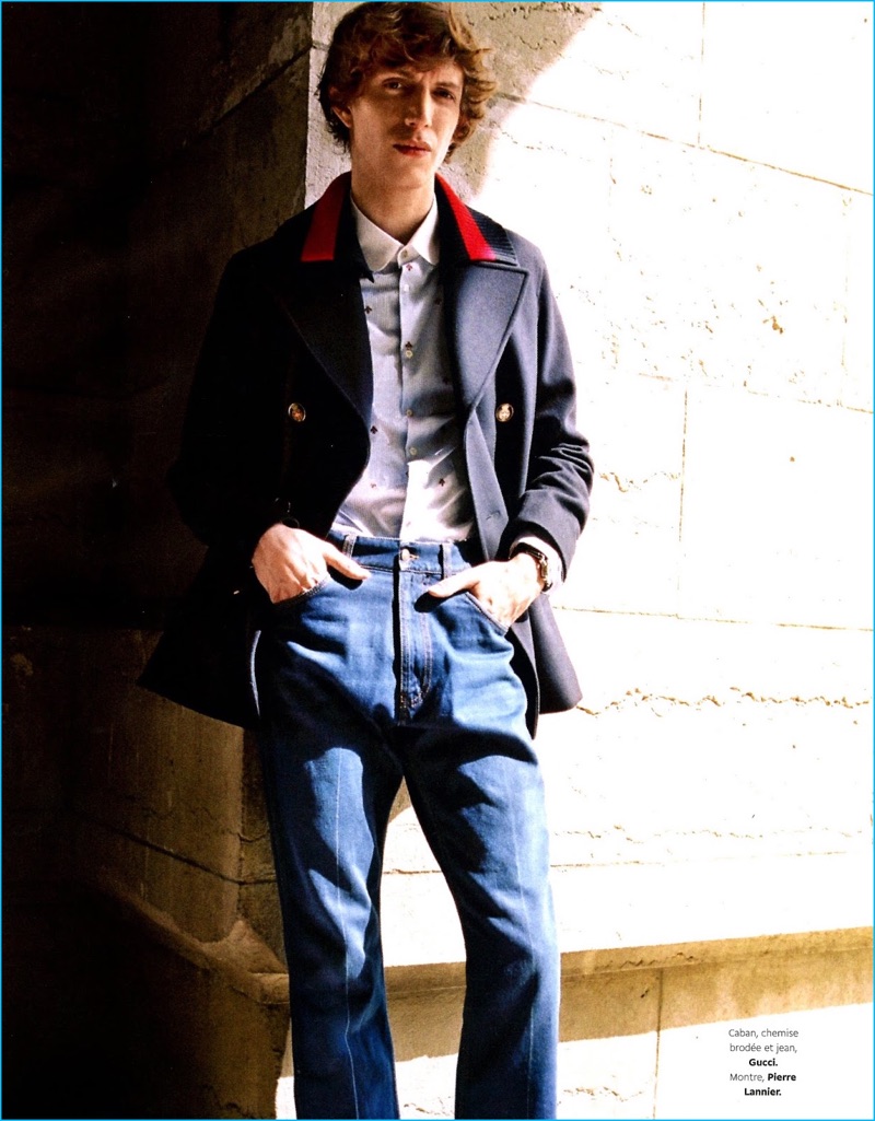 Front and center, Xavier Buestel dons a peacoat, shirt, and jeans by Gucci with a Pierre Lannier watch.