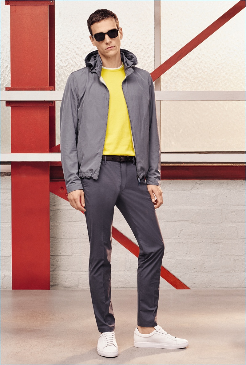 Alexandre Cunha wears a yellow and grey leisure outfit from BOSS Hugo Boss' spring-summer 2017 travel line.