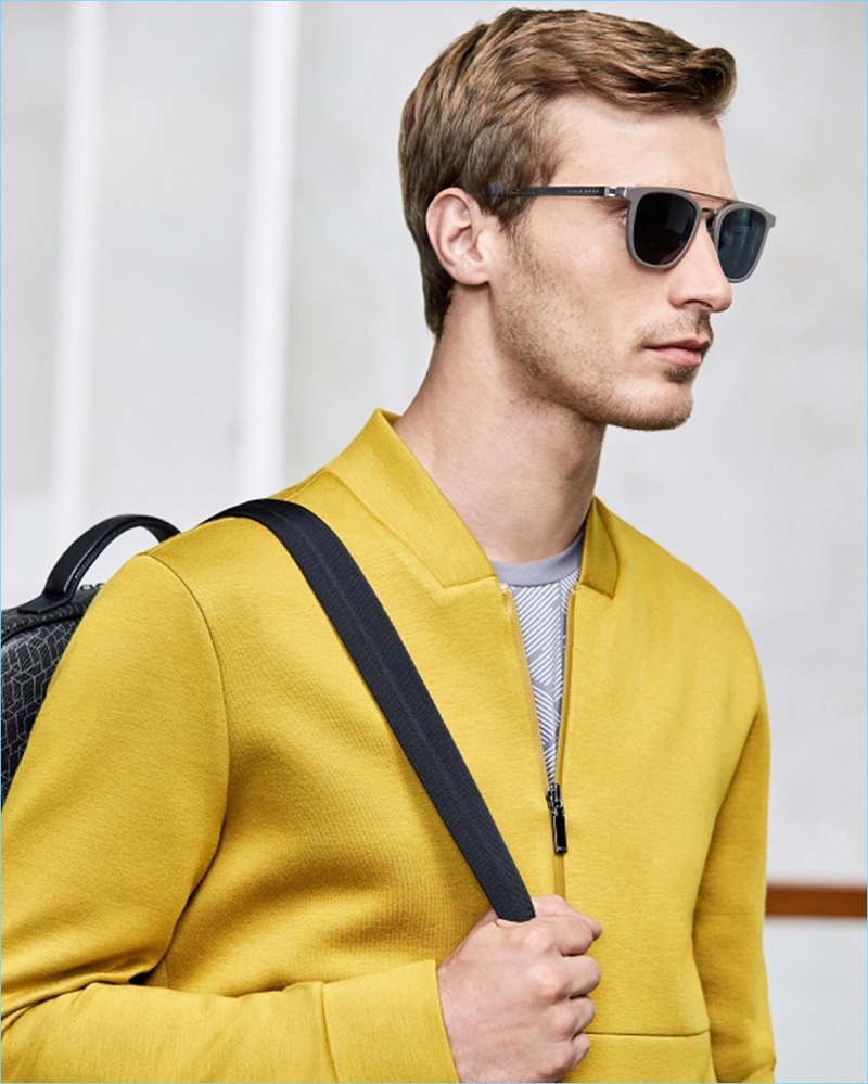French model Clément Chabernaud dons a yellow statement piece by BOSS Hugo Boss.