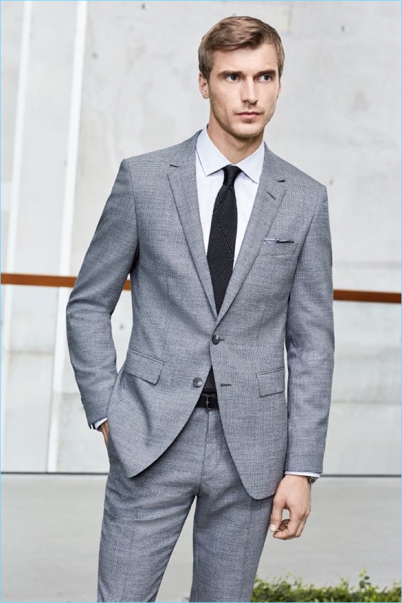 Clément Chabernaud dons a grey two-button suit from BOSS Hugo Boss' pre-spring 2017 collection.