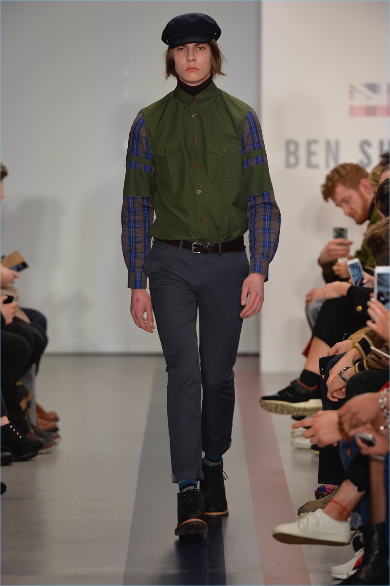 A military element pervades Ben Sherman's fall-winter 2017 collection with a two-pocket shirt in army green and plaid.