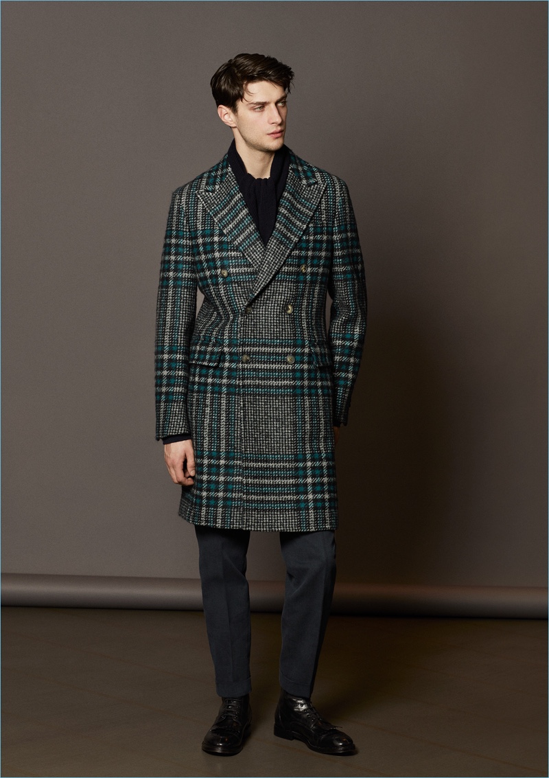 Model Matthew Bell dons a check double-breasted coat by Boglioli.