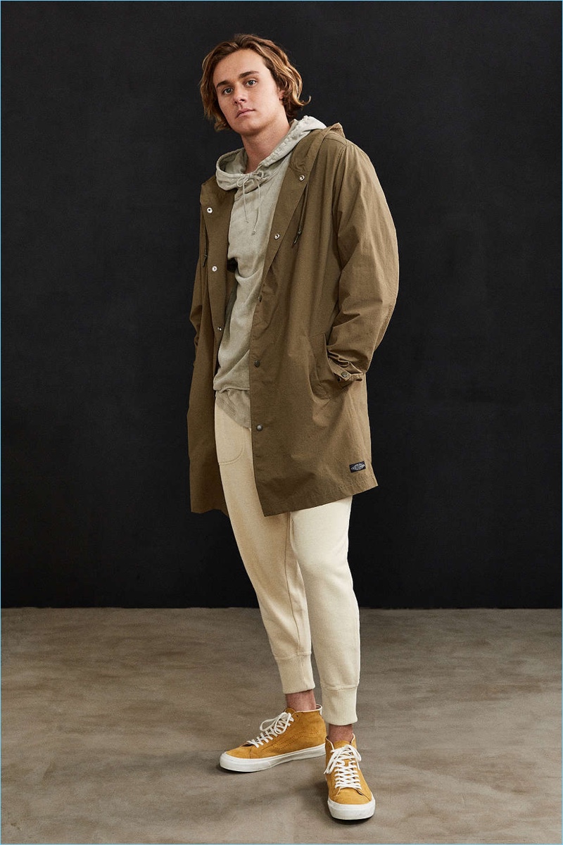 Leisure is front and center as Urban Outfitters styles a long parka jacket with joggers and a hooded sweatshirt.