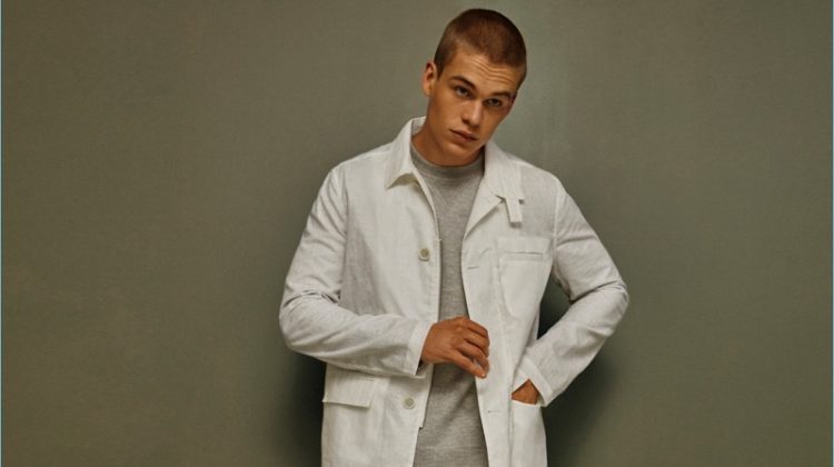Mitchell Slaggert dons a white spring look by Calvin Klein Collection.
