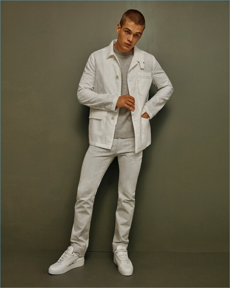 Mitchell Slaggert dons a white spring look by Calvin Klein Collection.