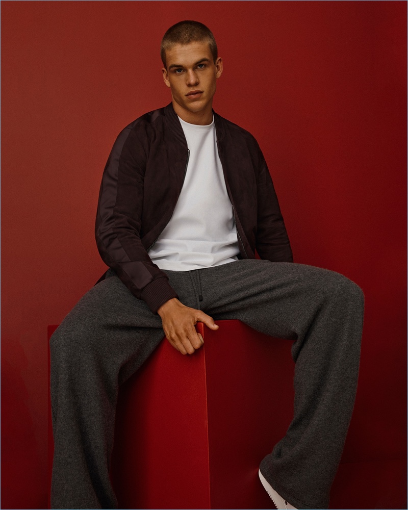 Model Mitchell Slaggert wears a suede bomber jacket with cashmere lounge pants by Calvin Klein Collection.